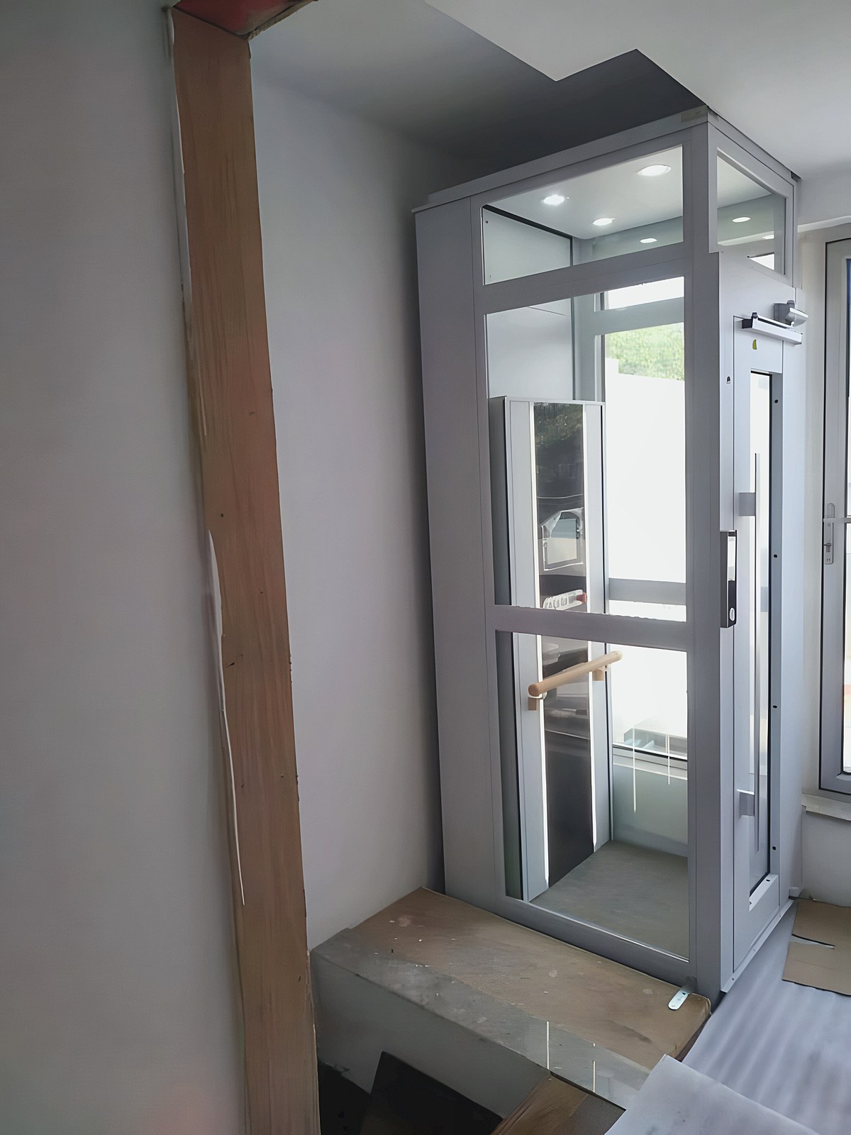 Glass home lift inside the villa after installation