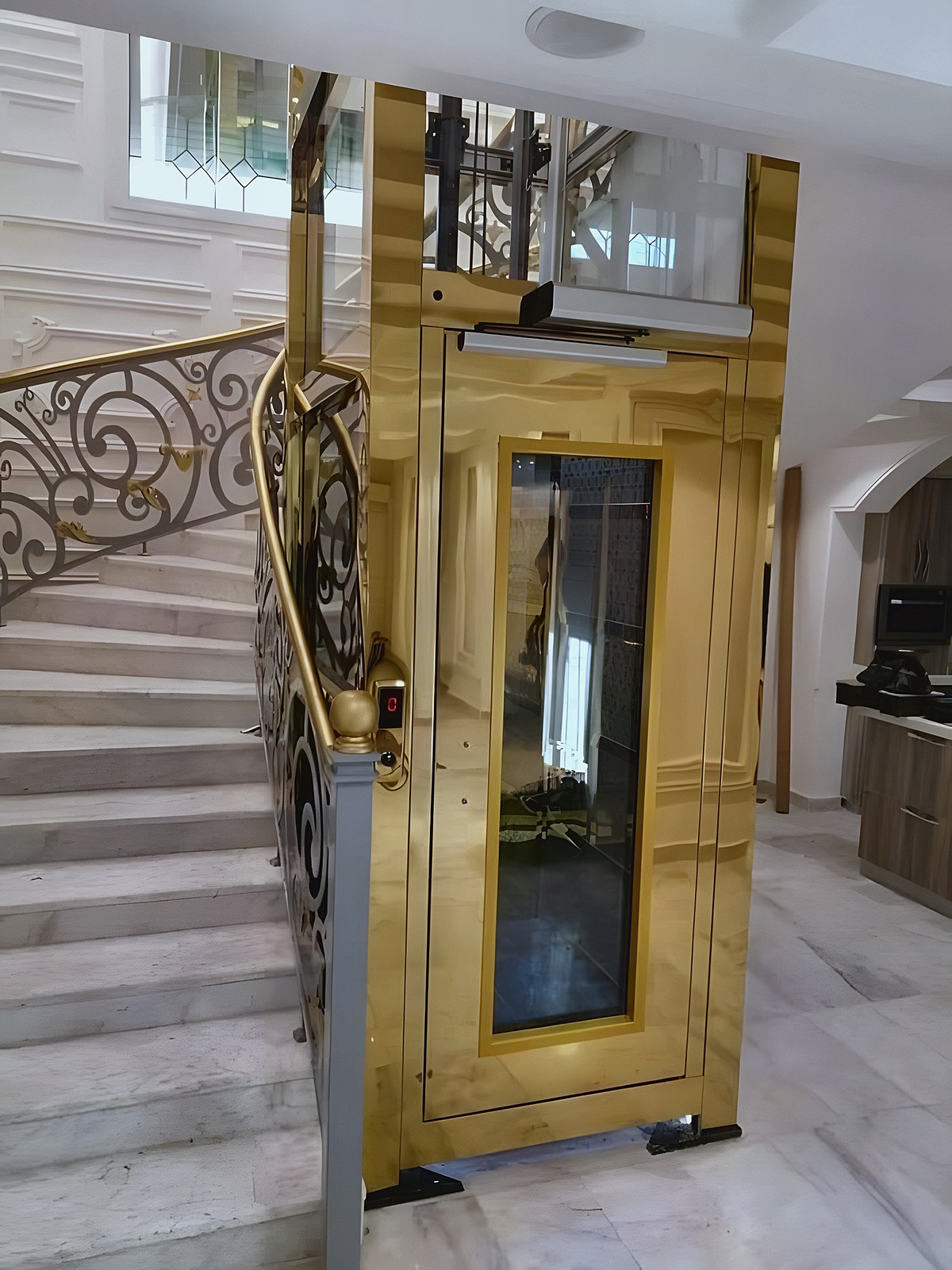 The gold lift at the stair landing