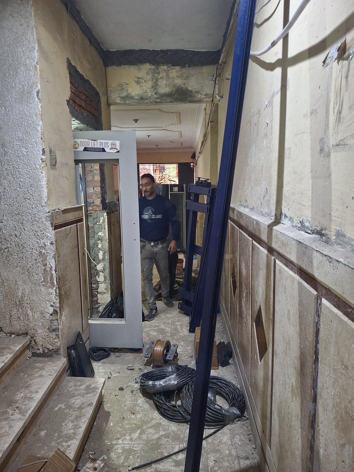 A SENSEI technician at the door opening