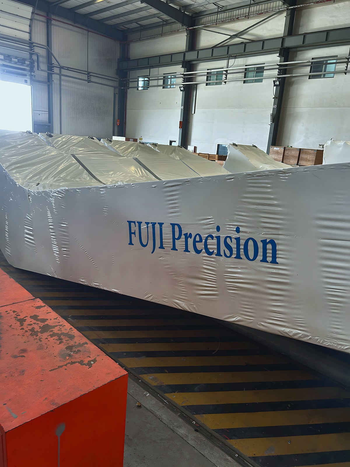 A FUJI Precision escalator wrapped in the factory before shipping